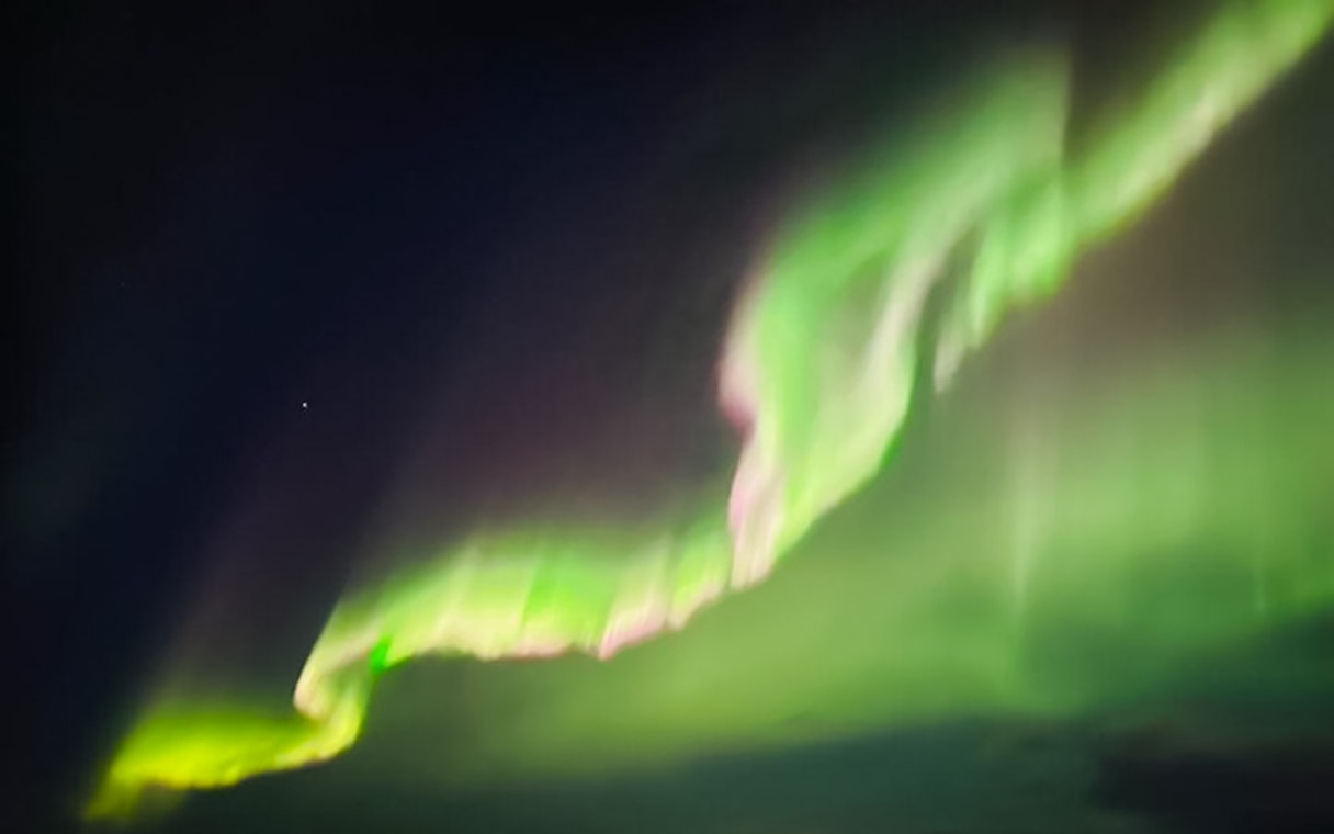 Northern lights display in the night sky over Lapland.