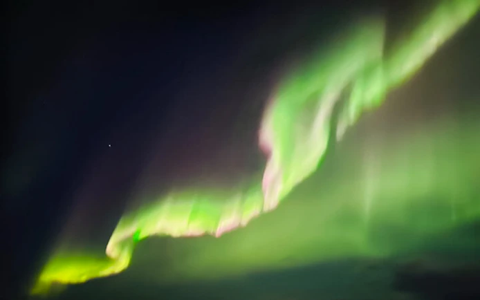 Northern lights display in the night sky over Lapland.