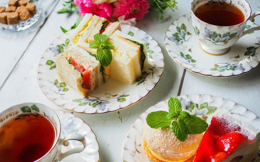 Afternoon tea with sandwiches and pastries at the British Museum.