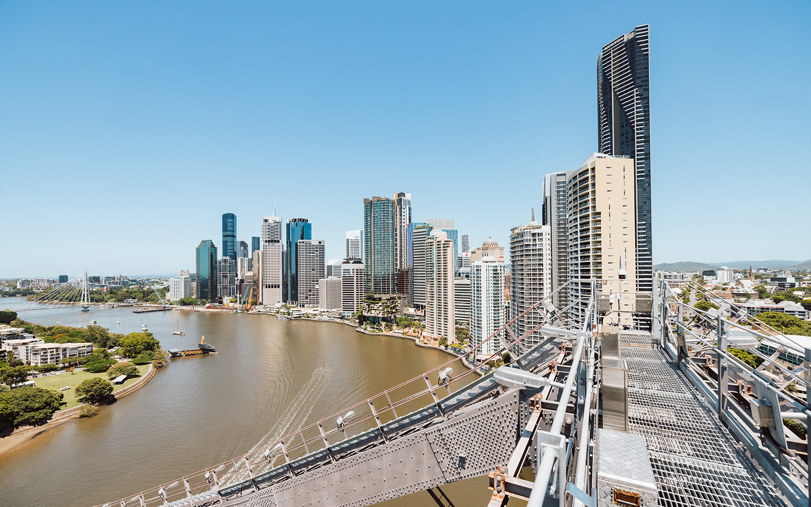 Brisbane city skyline and river viewed from Story Bridge Adventure Climb walkway.