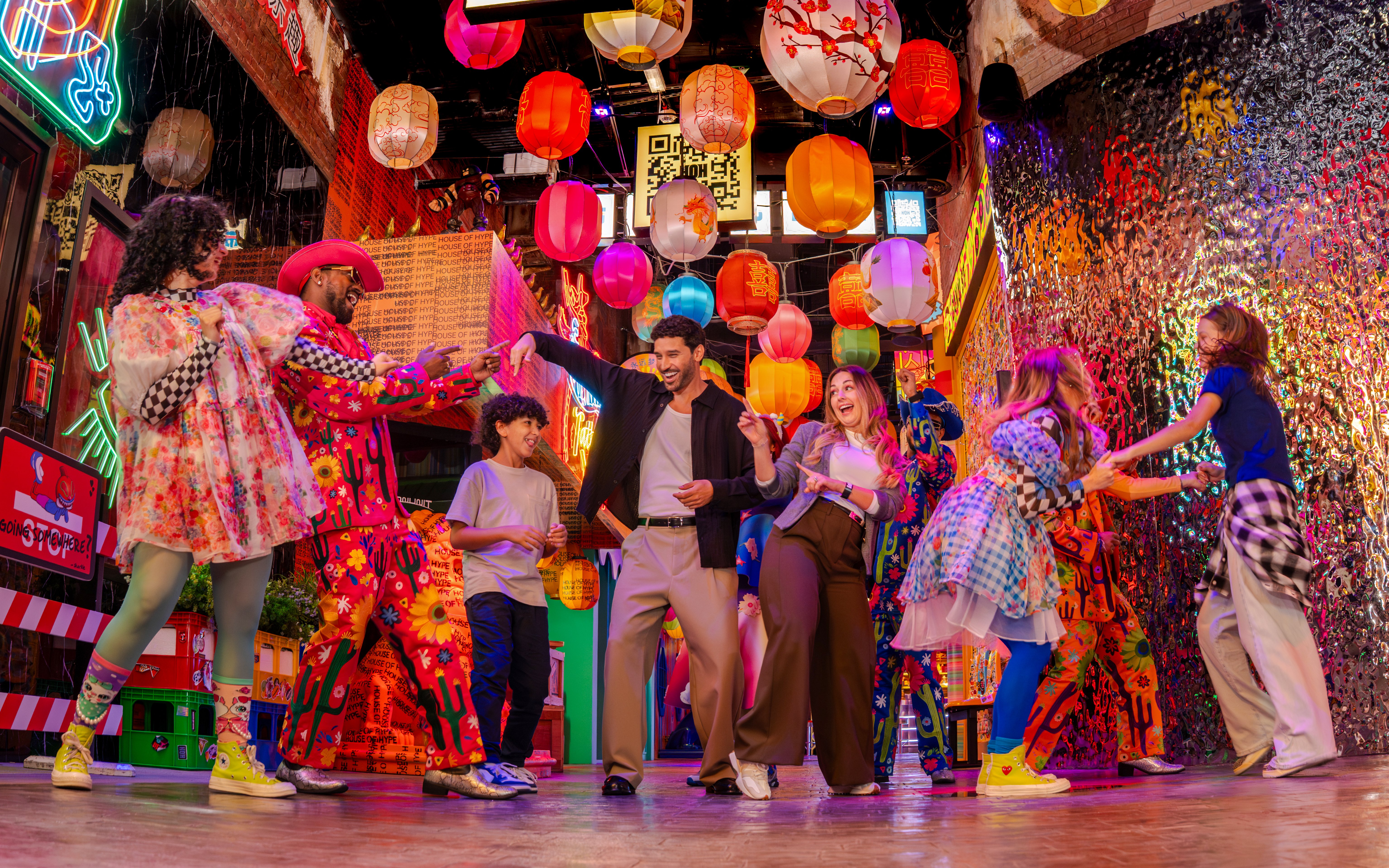 Group dancing under colorful lanterns at House Of Hype.