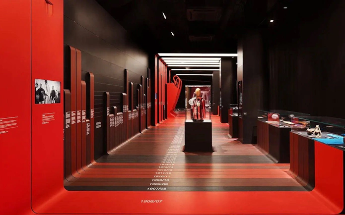 Casa Milan Museum exhibit with timeline and football memorabilia, Italy.