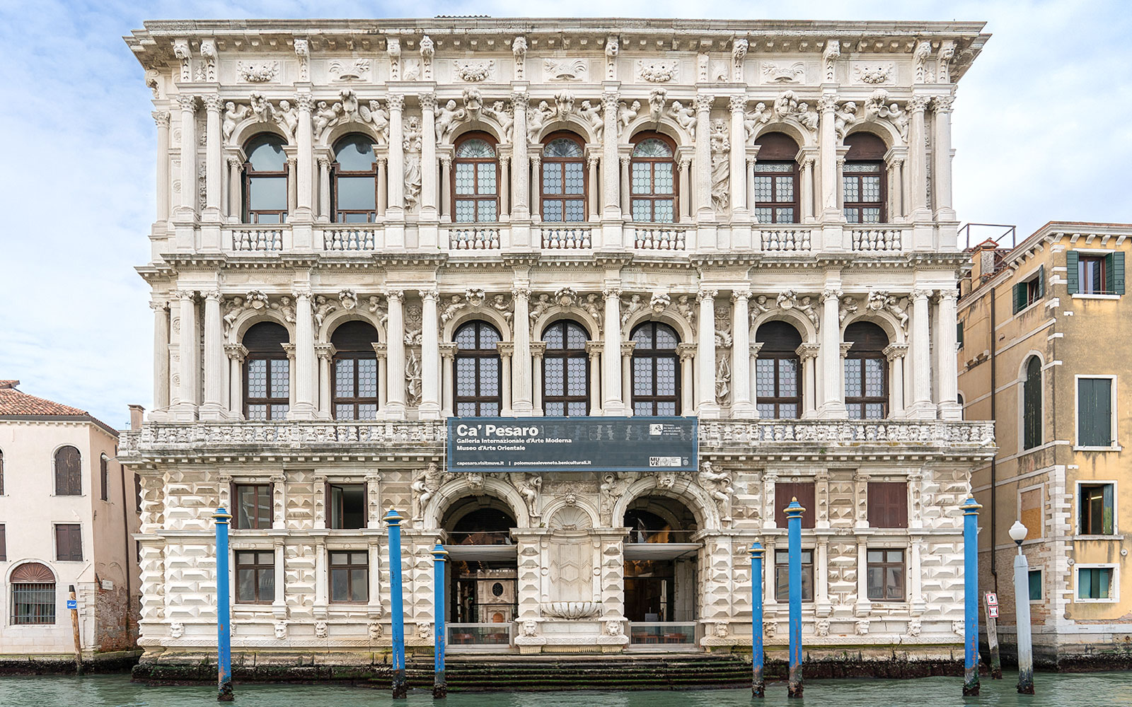 Ca Pesaro baroque marble palace on Grand Canal, Venice, in summer.