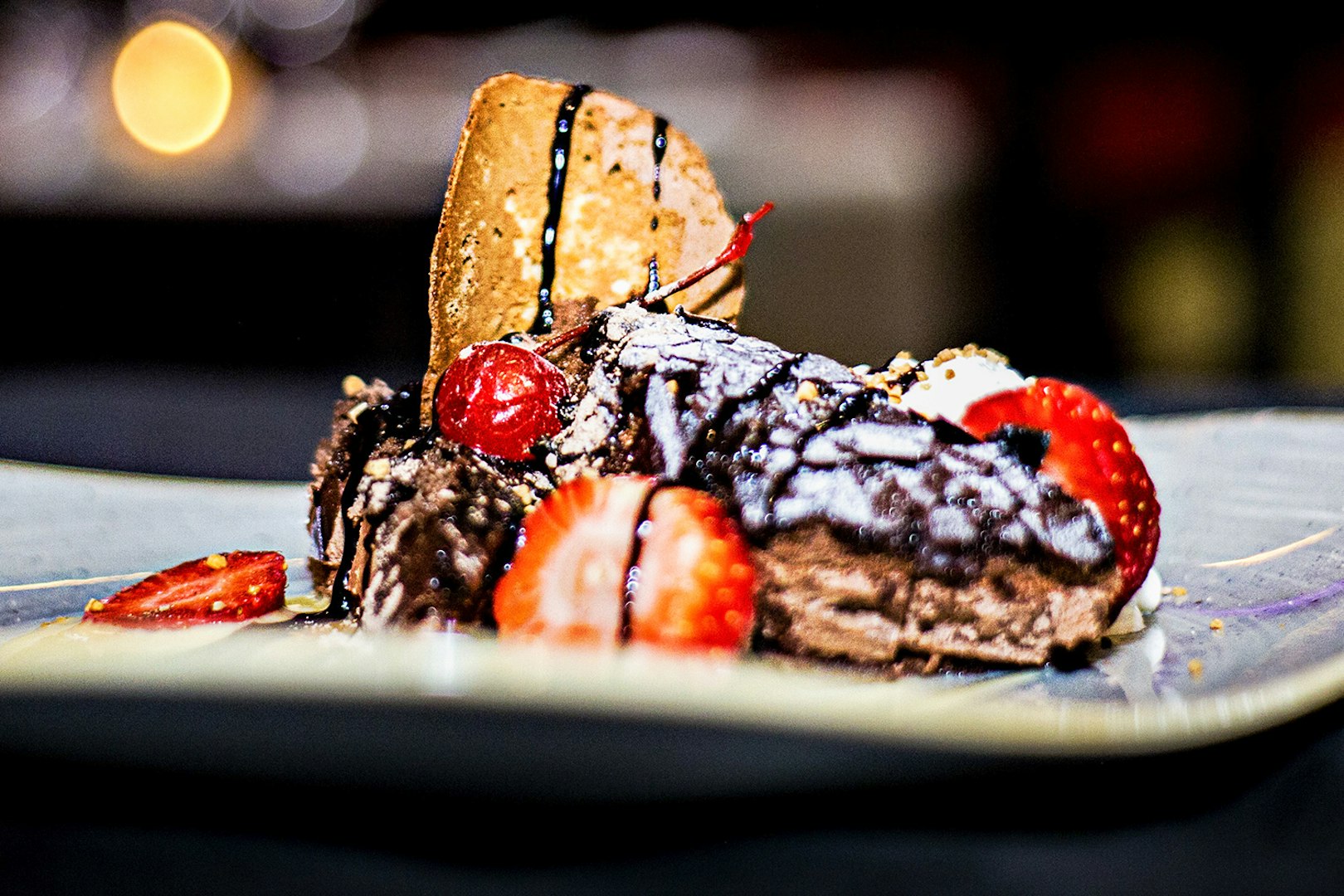 Dessert served at Tablao El Toro y la Luna during Flamenco Show, featuring strawberries and chocolate.
