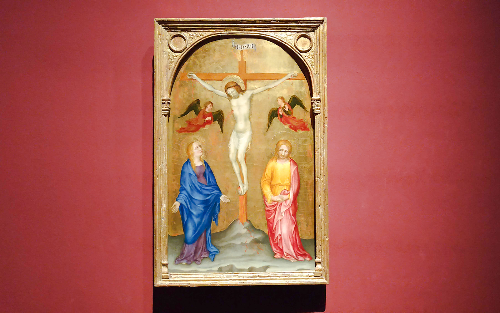 Crucifixion painting by Gentile da Fabriano at Pinacoteca di Brera, featuring Jesus on the cross.