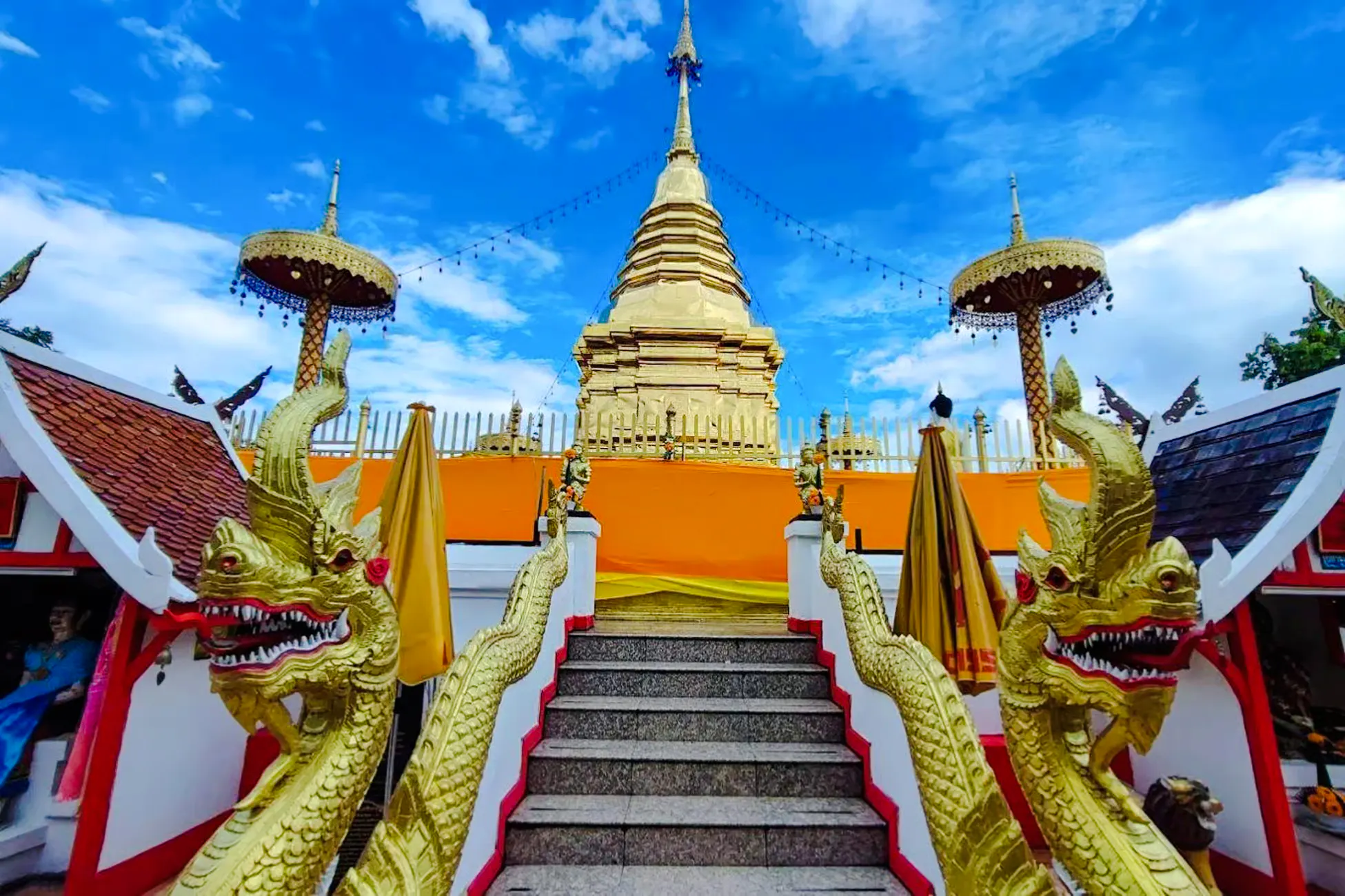 Golden temple staircase with dragon sculptures, Chiang Mai, Thailand.
