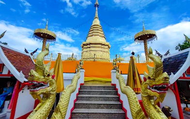 Golden temple staircase with dragon sculptures, Chiang Mai, Thailand.