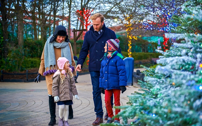 Family enjoying Christmas decorations at Legoland London.