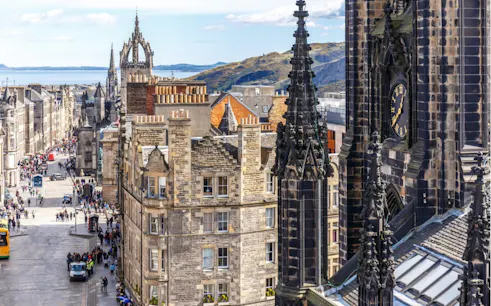 Edinburgh cityscape with historic buildings and St Giles' Cathedral spire.