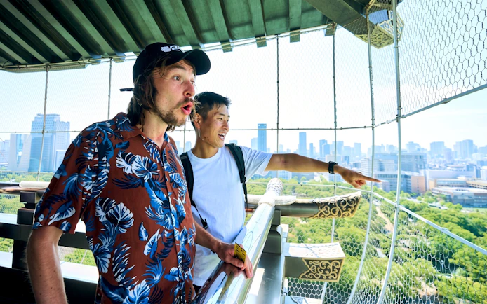 Visitors enjoying the view from the observation deck at Osaka Castle keep, Osaka, Japan.