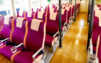 Ferry seating area with rows of red seats at Tanah Merah Terminal for Sindo Ferry tickets.