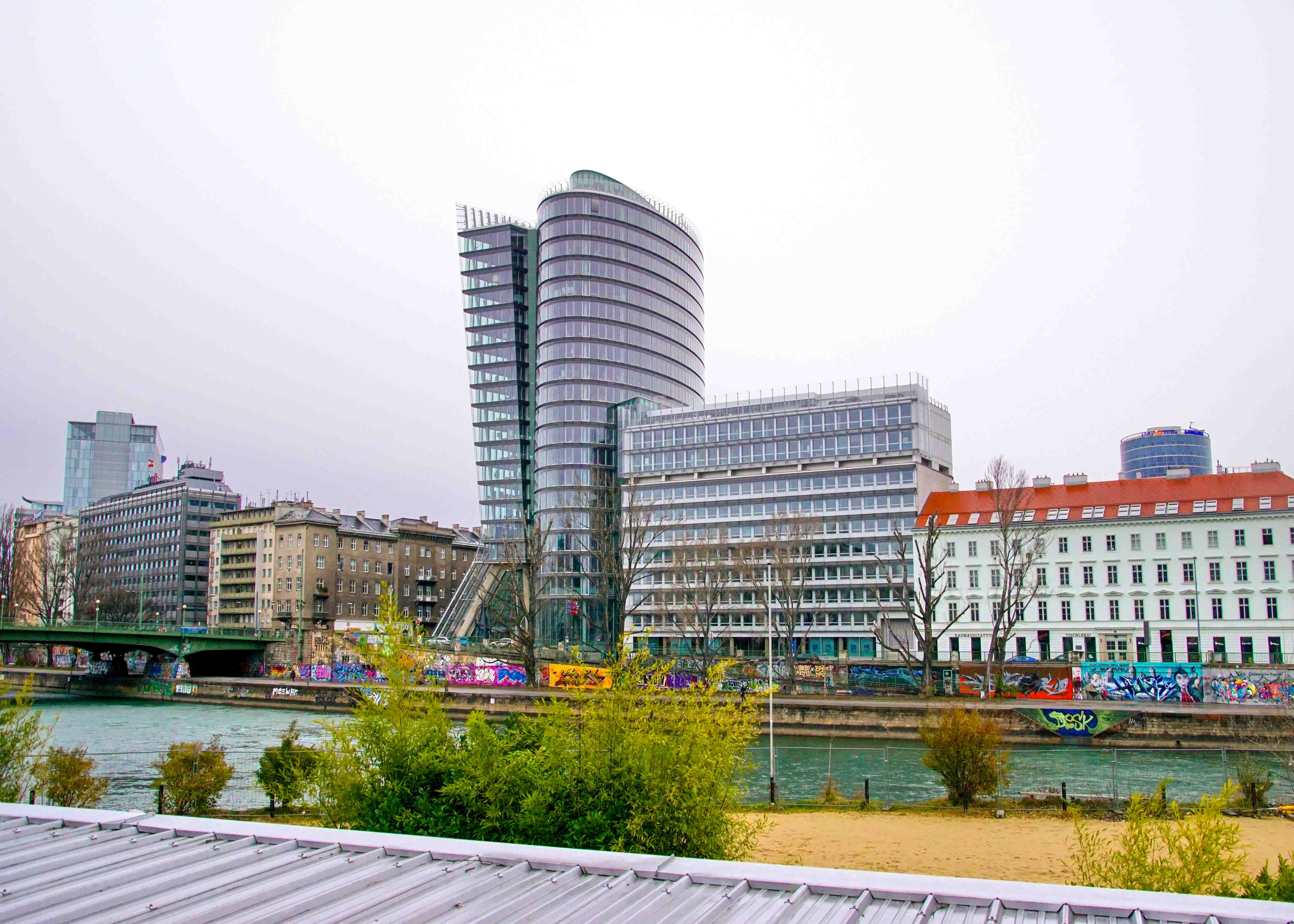 Uniqa Tower in Vienna, Austria, with modern glass architecture reflecting the cityscape.