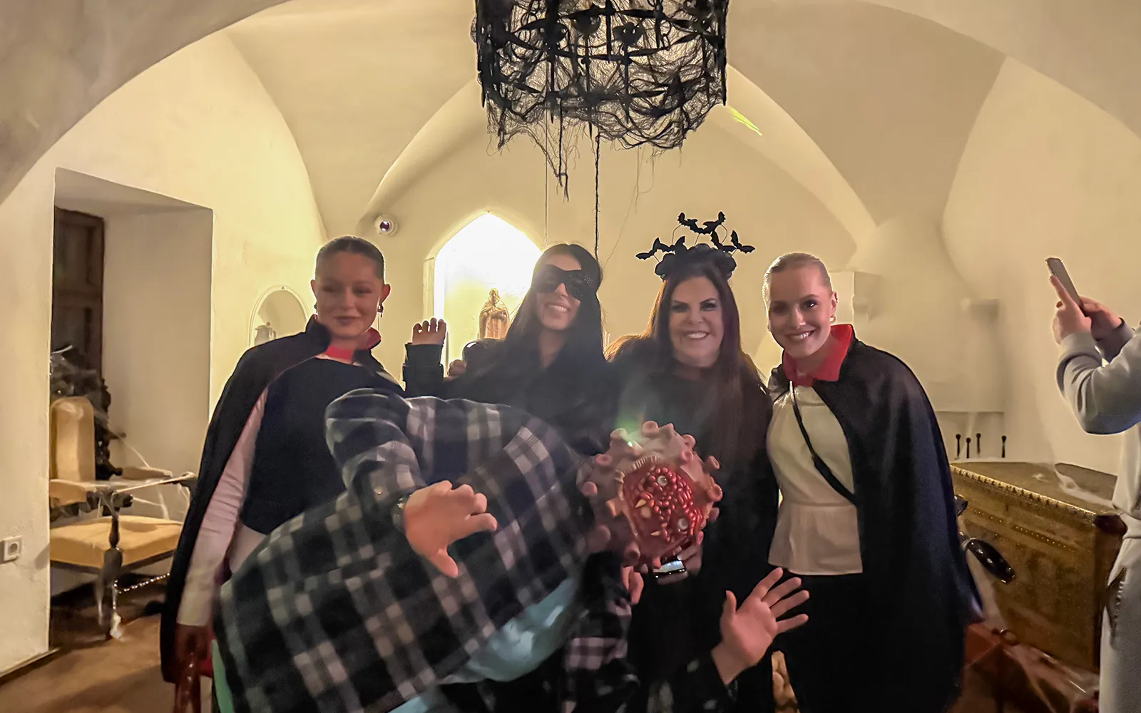 Guests in costumes at Bran Castle Halloween party.