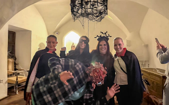Guests in costumes at Bran Castle Halloween party.