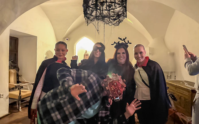 Guests in costumes at Bran Castle Halloween party.