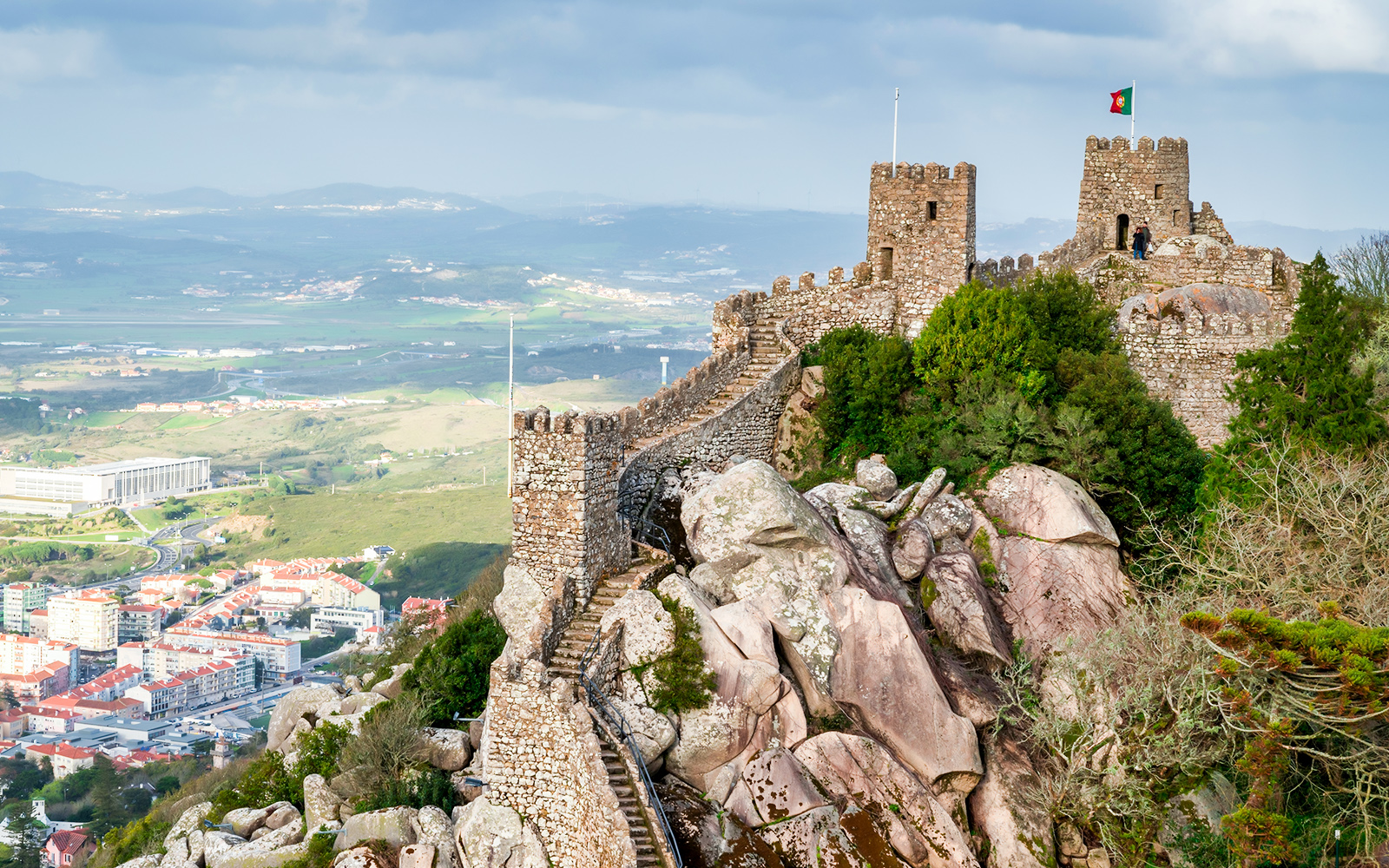 Moorish Castle in Sintra, Portugal, with stone walls and towers overlooking the landscape.