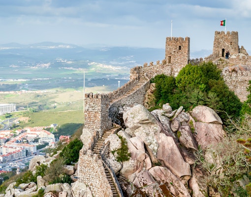 Moorish Castle in Sintra, Portugal, with stone walls and towers overlooking the landscape.