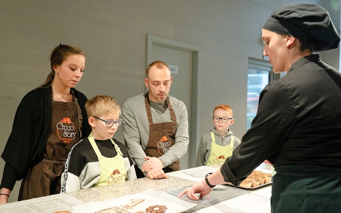 Guests learning chocolate making at Choco-Story Brussels Museum workshop.