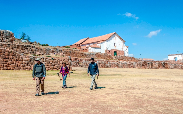 Visitors walking at Chinchero Archaeological Park, Sacred Valley of the Incas, Peru.