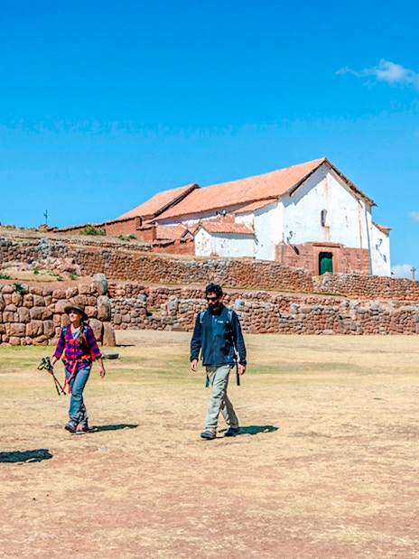 Visitors walking at Chinchero Archaeological Park, Sacred Valley of the Incas, Peru.