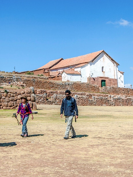 Visitors walking at Chinchero Archaeological Park, Sacred Valley of the Incas, Peru.