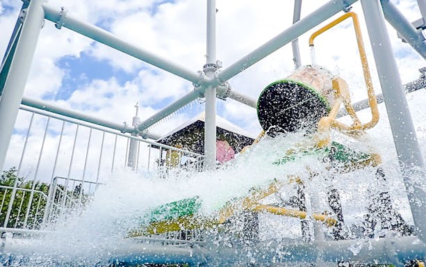 Water bucket splashes at Hakone Kowakien Yunessun water playground, Japan.