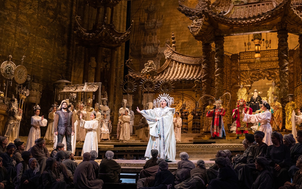 Opera performance of Turandot with elaborate costumes and set design.