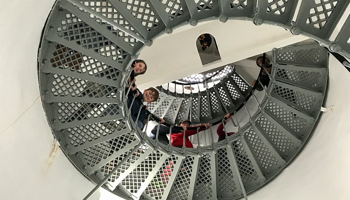 Kids climbing up lighthouse stairs, Bruny island, Hobart