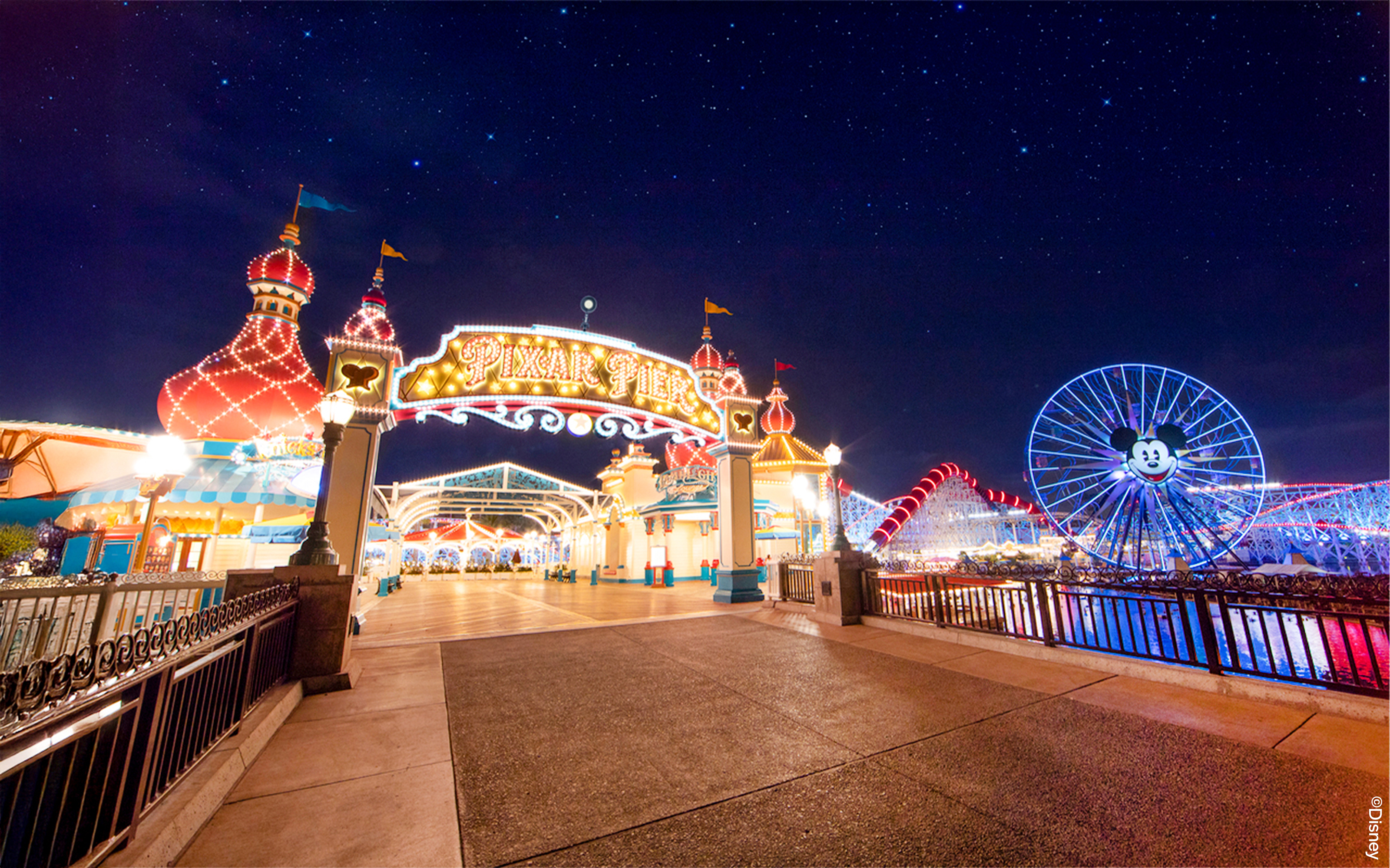 Pixar Pier entrance and Mickey Ferris wheel at Disneyland Adventure Park, California.