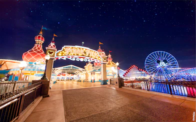 Pixar Pier entrance and Mickey Ferris wheel at Disneyland Adventure Park, California.