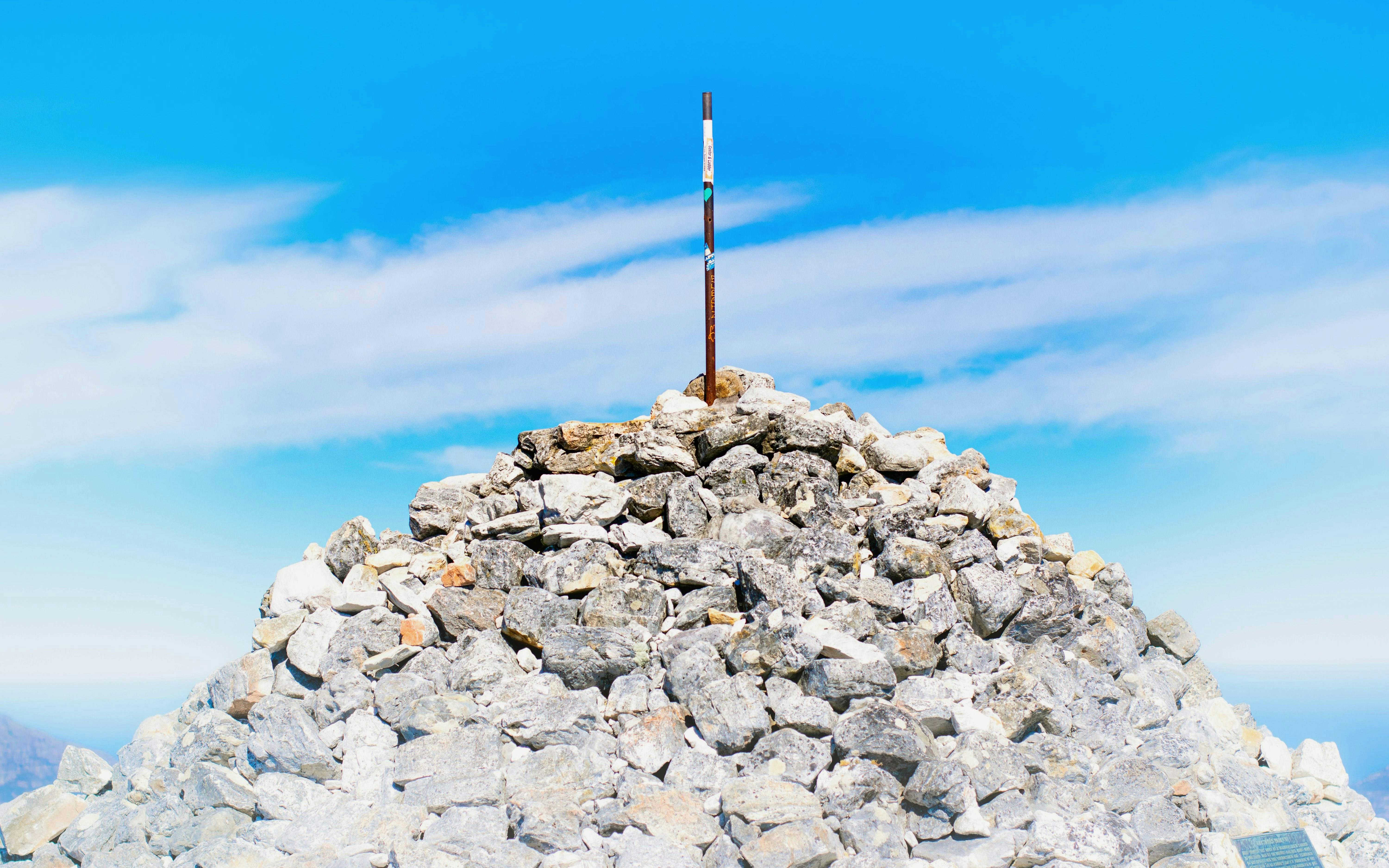 Maclear's Beacon atop Table Mountain under a bright blue sky.