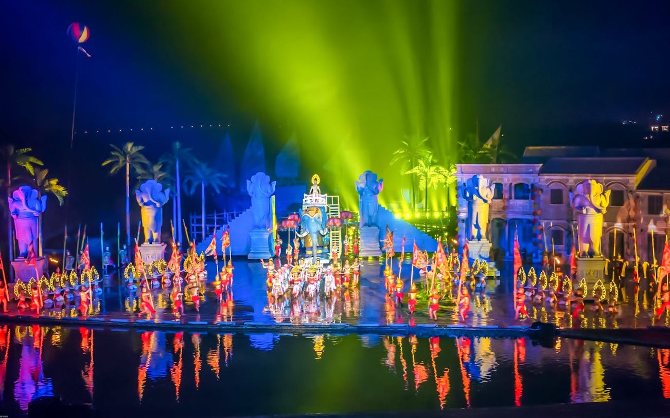 Hoi An Memories Show with performers in colorful costumes on a vibrant stage.