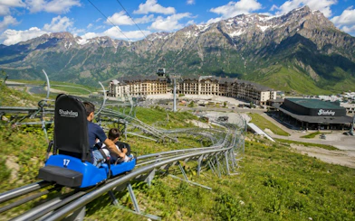 Shahdag mountain coaster ride with scenic view of resort and mountains in Azerbaijan.