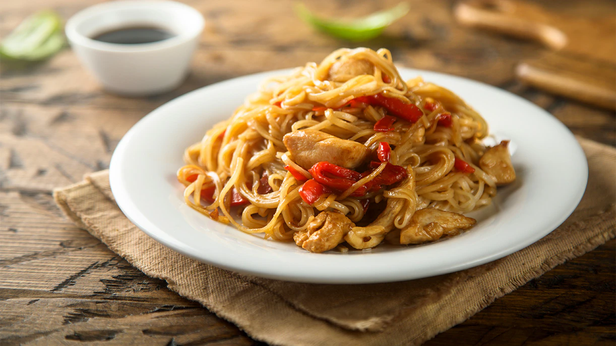 Stir-fried noodles with chicken and red peppers at Chinatown Complex Food Centre, Singapore.