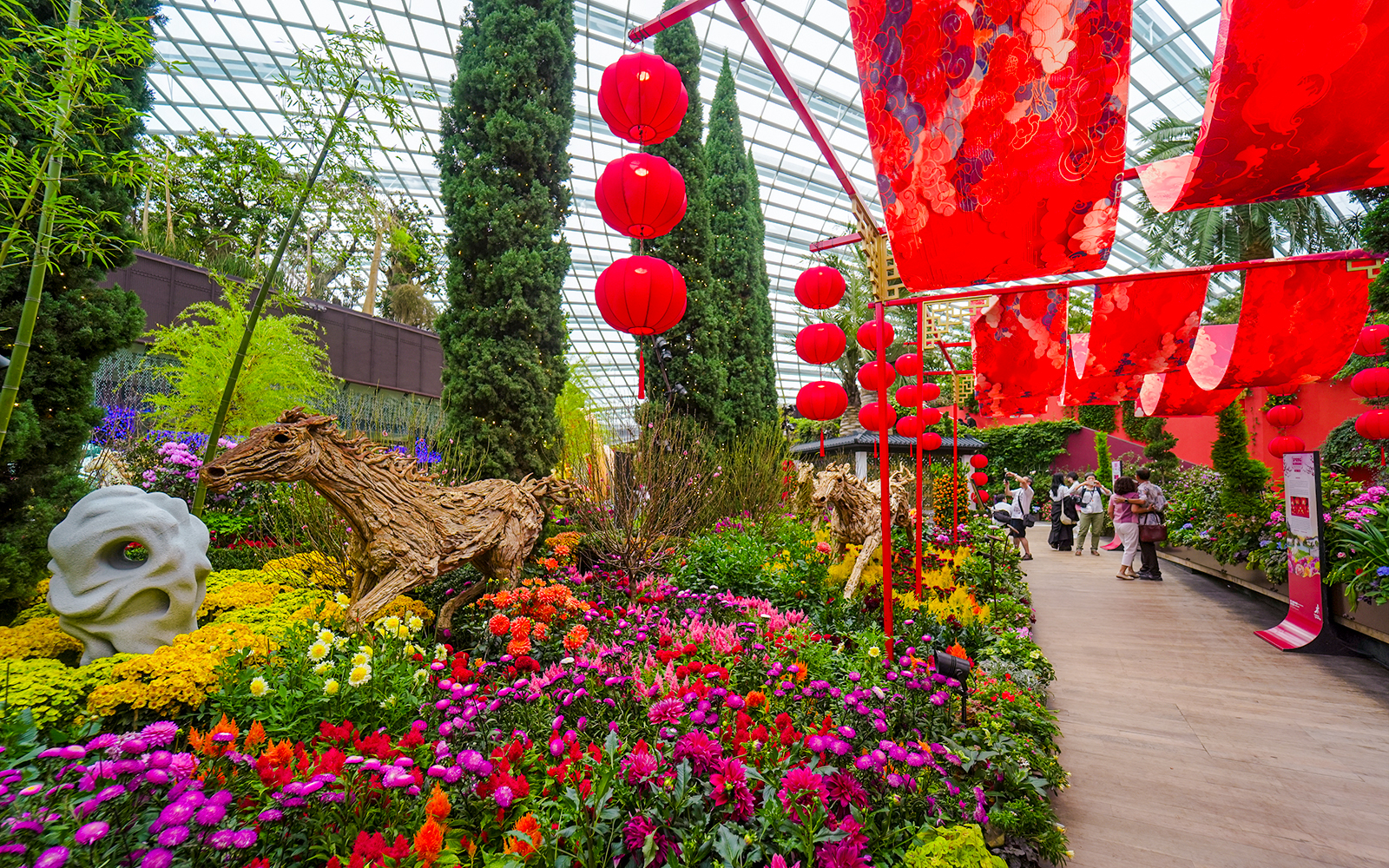 Spring blossoms and red lanterns in Flower Dome, Gardens by the Bay, Singapore.