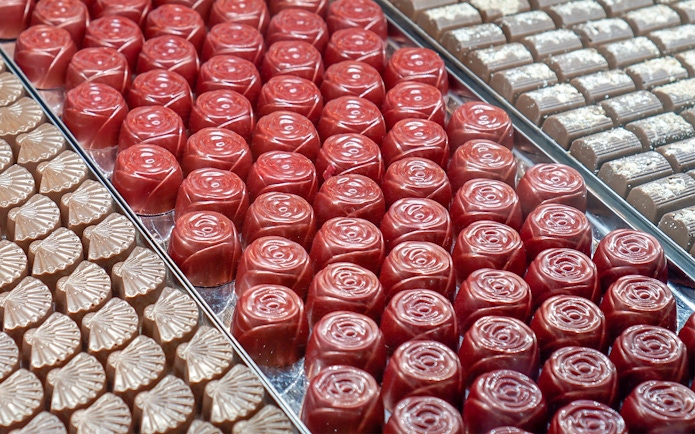 Assorted chocolates displayed on trays during Yarra Valley and Dandenong Ranges tour.