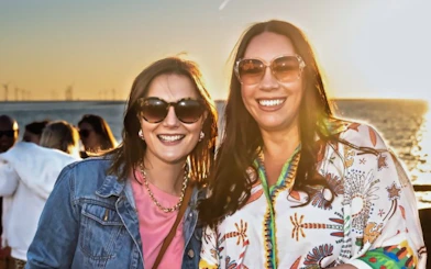 Two people enjoying a sunset cruise on the Mersey Ferries.