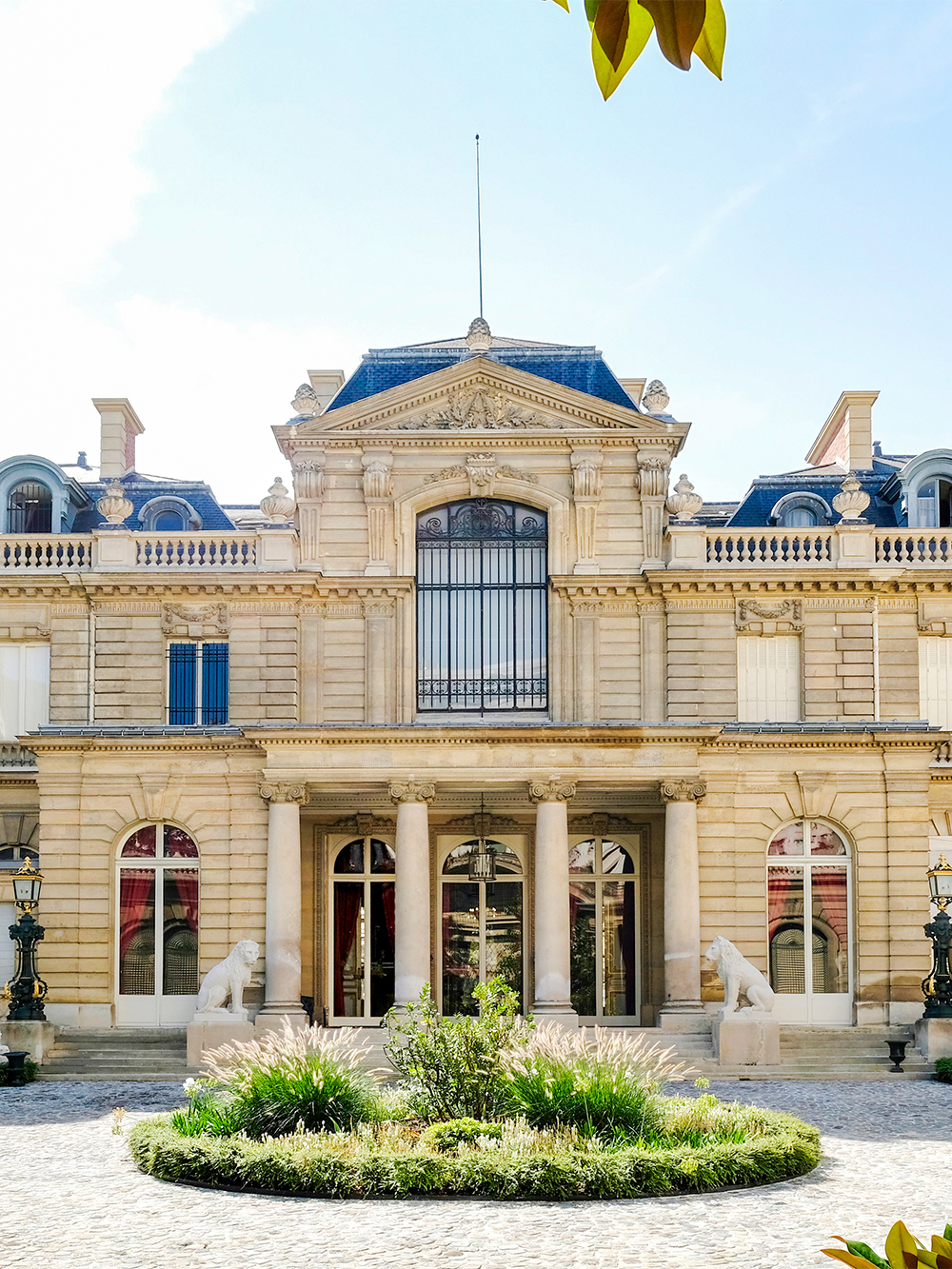 Jacquemart André Museum facade with columns and statues in Paris.