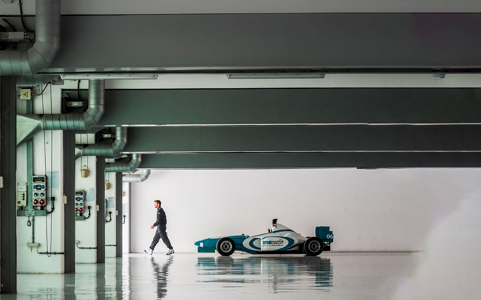 Yas Marina Circuit Formula car in a garage, Dubai driving experience.