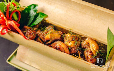 Vietnamese dish in bamboo box at HOME Hoi An Restaurant, Hoi An.