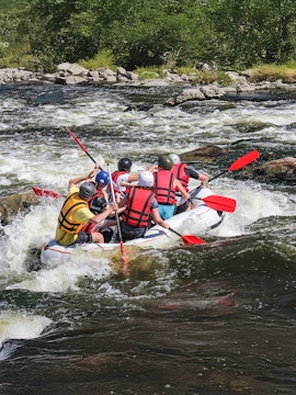 Group rafting on a rapid river in Phuket, Thailand.