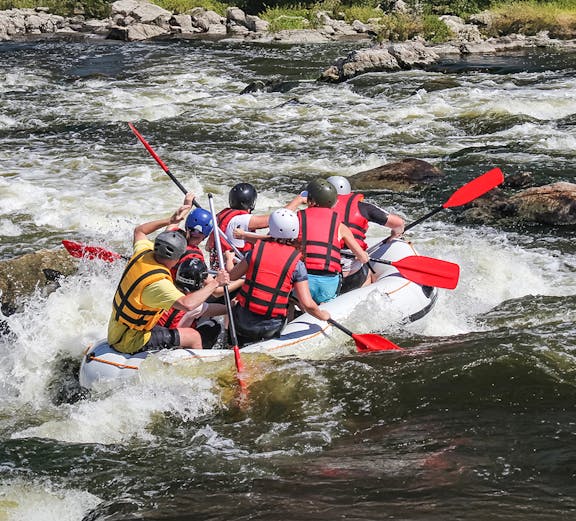 Group rafting on a rapid river in Phuket, Thailand.