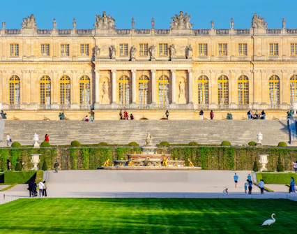 Versailles Palace facade with gardens and fountain, Jardin des Etangs Gobert, France.