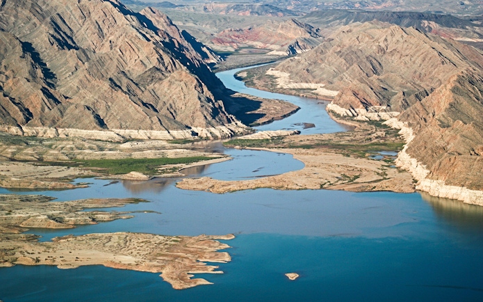 Aerial view of the Colorado River winding through the Grand Canyon West Rim.