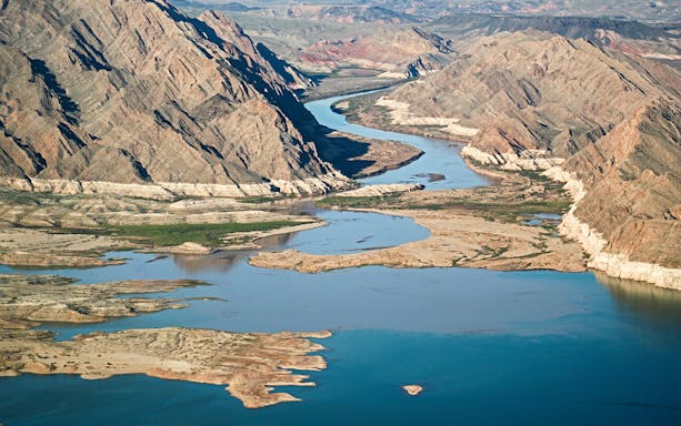 Aerial view of the Colorado River winding through the Grand Canyon West Rim.