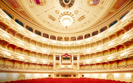 Semperoper Opera House interior with ornate balconies and chandelier, Dresden.