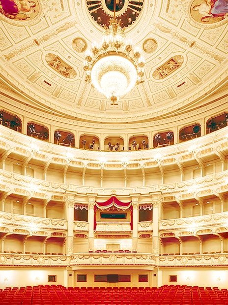 Semperoper Opera House interior with ornate balconies and chandelier, Dresden.