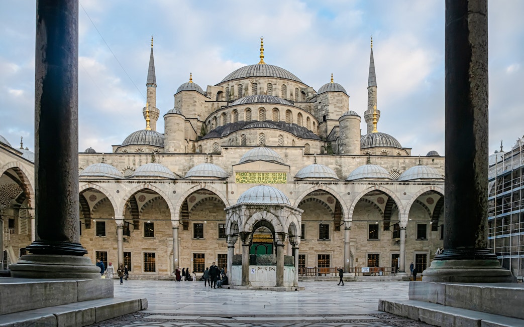 Blue Mosque courtyard with central fountain and domes, Istanbul.