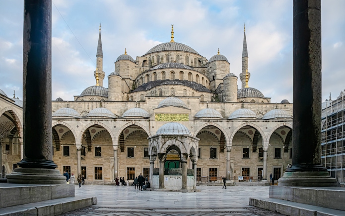 Blue Mosque courtyard with central fountain and domes, Istanbul.