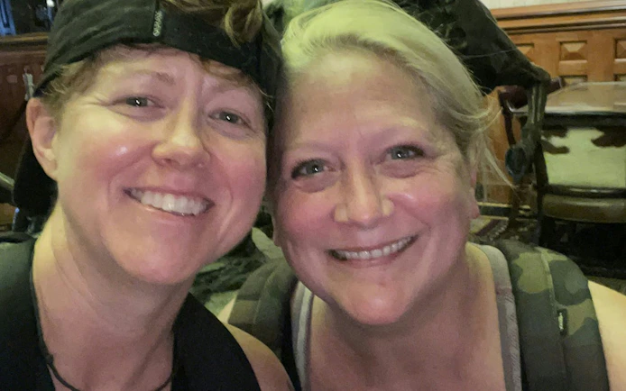 Two people smiling during the Ghosts of Austin self-guided city exploration game.